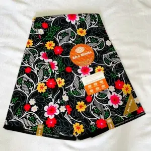 Premium Ankara/Kitenge fabric with black background, vibrant red, yellow, green, and white floral wax prints, and double-sided bright colors.