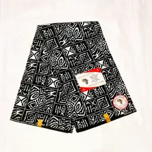 Premium Kitenge fabric featuring black and white geometric patterns with squares, spirals, and abstract lines on durable cotton.