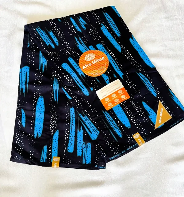 Premium Ankara/Kitenge fabric featuring elongated blue shapes with white dot accents on a bold black background.