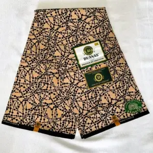 Premium Ankara/Kitenge fabric featuring vibrant floral and leaf patterns in yellow, pink, brown, and black on a durable cotton base.