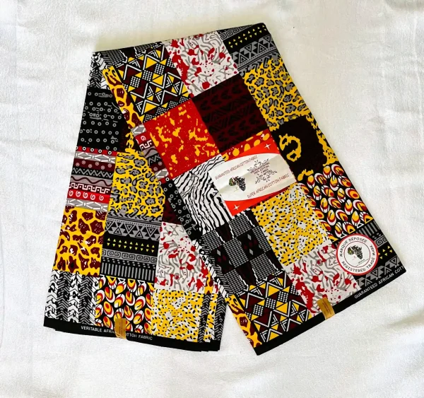 Premium Ankara/Kitenge fabric with vibrant patchwork patterns of geometric shapes, animal prints, and abstract designs in red, yellow, black, and white.