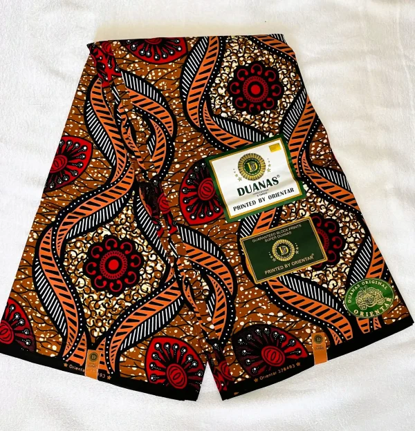 Premium Ankara/Kitenge fabric with floral and geometric patterns in rich brown, black, white, and red hues on a durable cotton base.