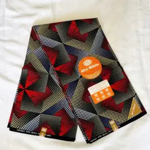 Premium Ankara/Kitenge fabric featuring bold geometric shapes in red, black, yellow, blue, and white on durable cotton with white dotted accents.