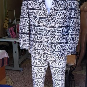 Stylish Kitenge suit with a unique pattern, high-quality and durable, custom-made to fit preferences and size, supporting those in need across Africa.
