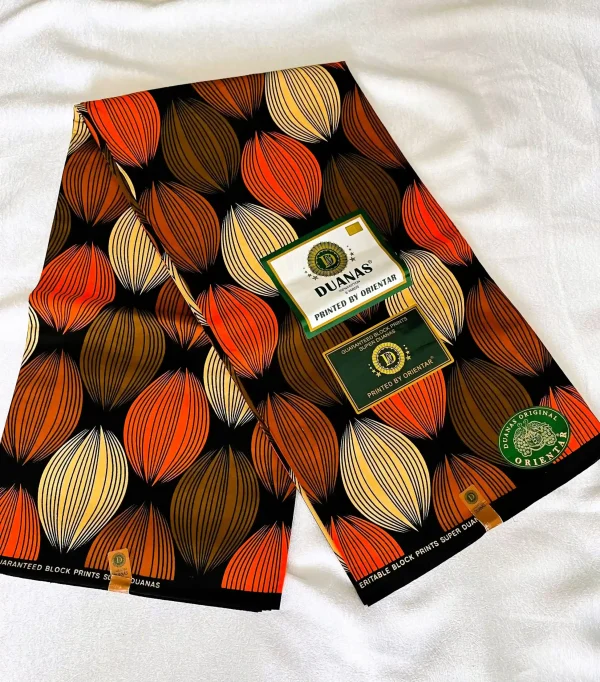 Premium Cotton Kitenge fabric with bold leaf patterns in orange, brown, and cream on black cotton.