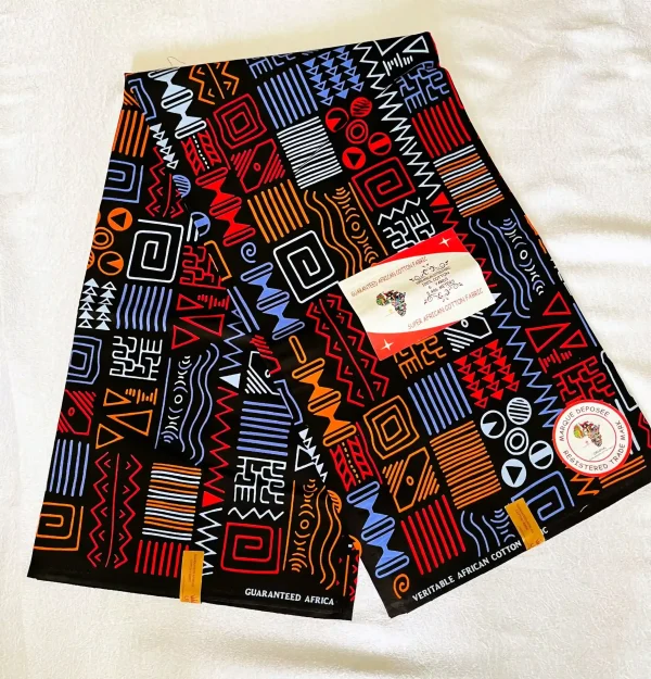 Premium Cotton Kitenge fabric with bold geometric patterns in red, blue, orange, and white on black cotton.