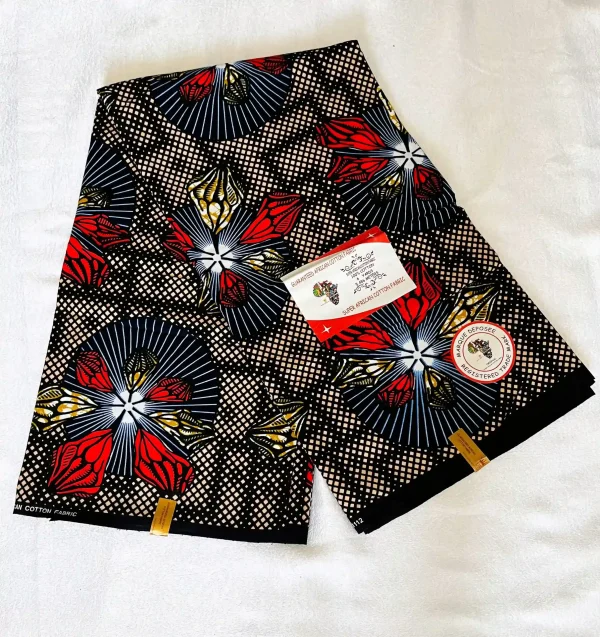 Premium Cotton Kitenge fabric featuring vibrant floral patterns in red, blue, and gold on a black base, crafted from durable African cotton.
