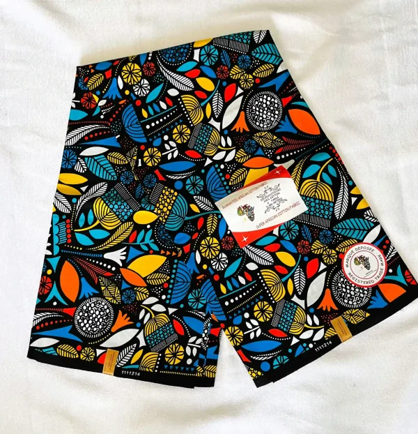 Premium Cotton Kitenge fabric featuring colorful abstract patterns in blue, yellow, orange, red, and white on a sleek black backdrop, crafted from durable African cotton.