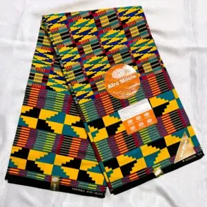 Colorful fabric with a traditional African Kente pattern in yellow, green, blue, red, black.
