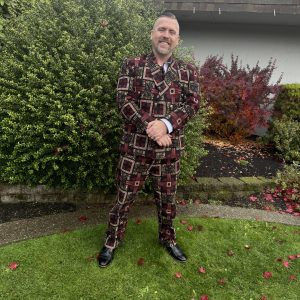 Stylish Kitenge suit with a unique pattern, high-quality and durable, custom-made to fit preferences and size, supporting those in need across Africa.
